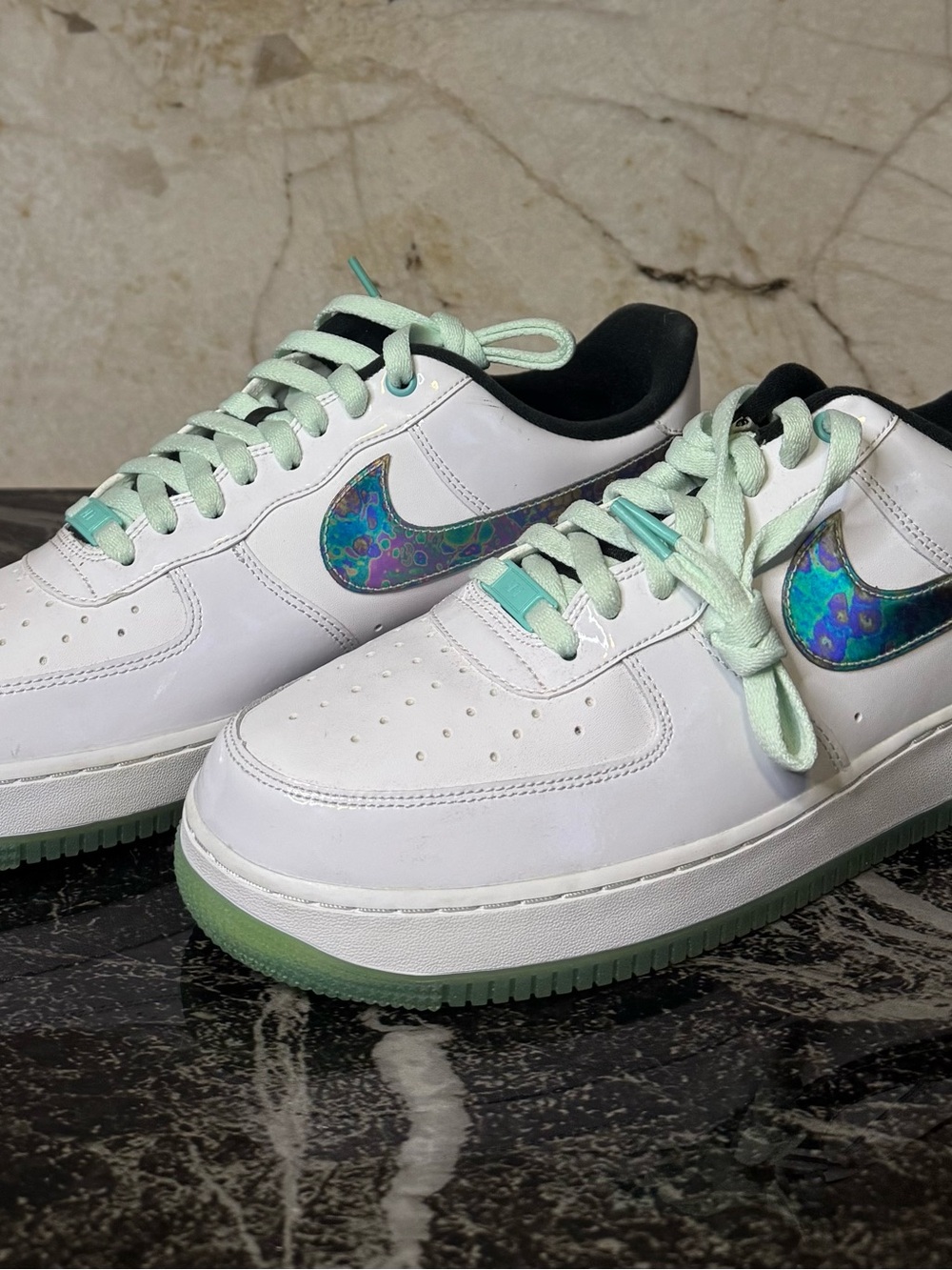 Nike White Sneakers with Mint Green Accents and Iridescent Swoosh